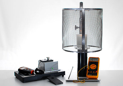 a candle test meter, test cage and digital thermometer