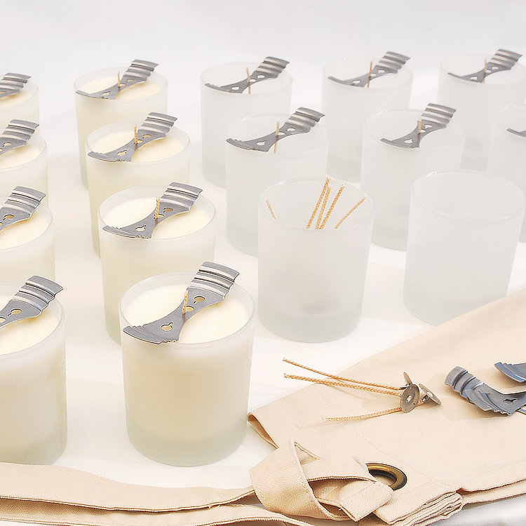 many handmade soy candles being made